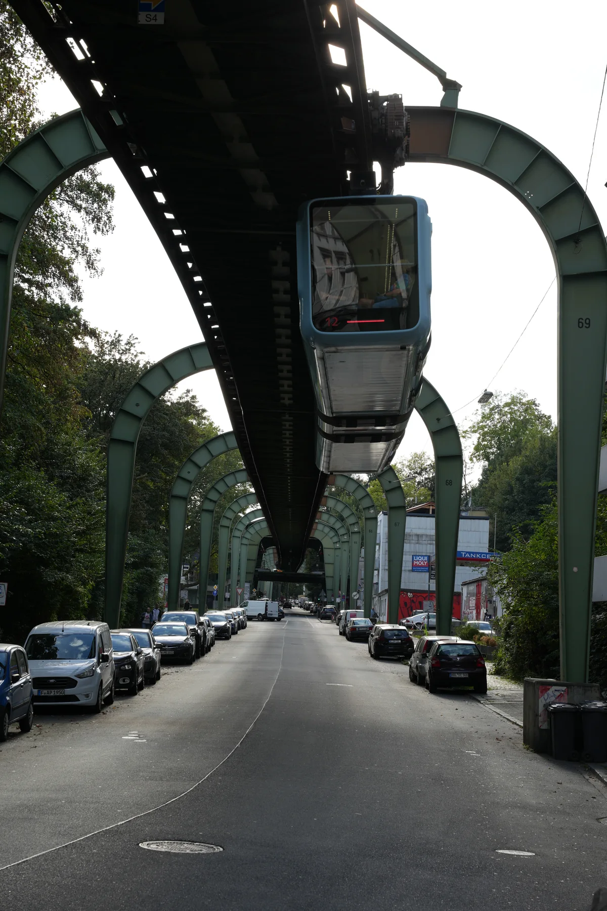 A Schwebebahn train suspended above a street in Wuppertal