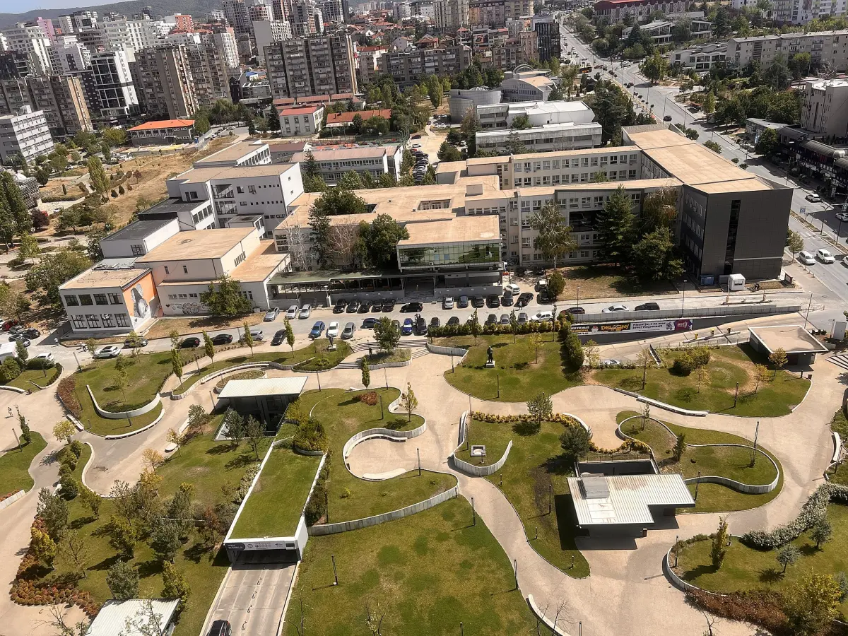 The University of Prishtina campus and the apartment blocks around it, seen from above in summer 2025