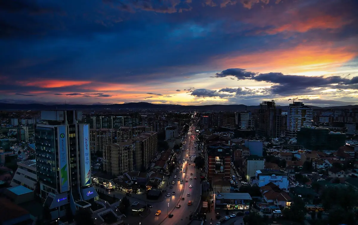 Prishtina at dusk, looking down Bill Clinton Boulevard from the tower of the Mother Teresa Cathedral